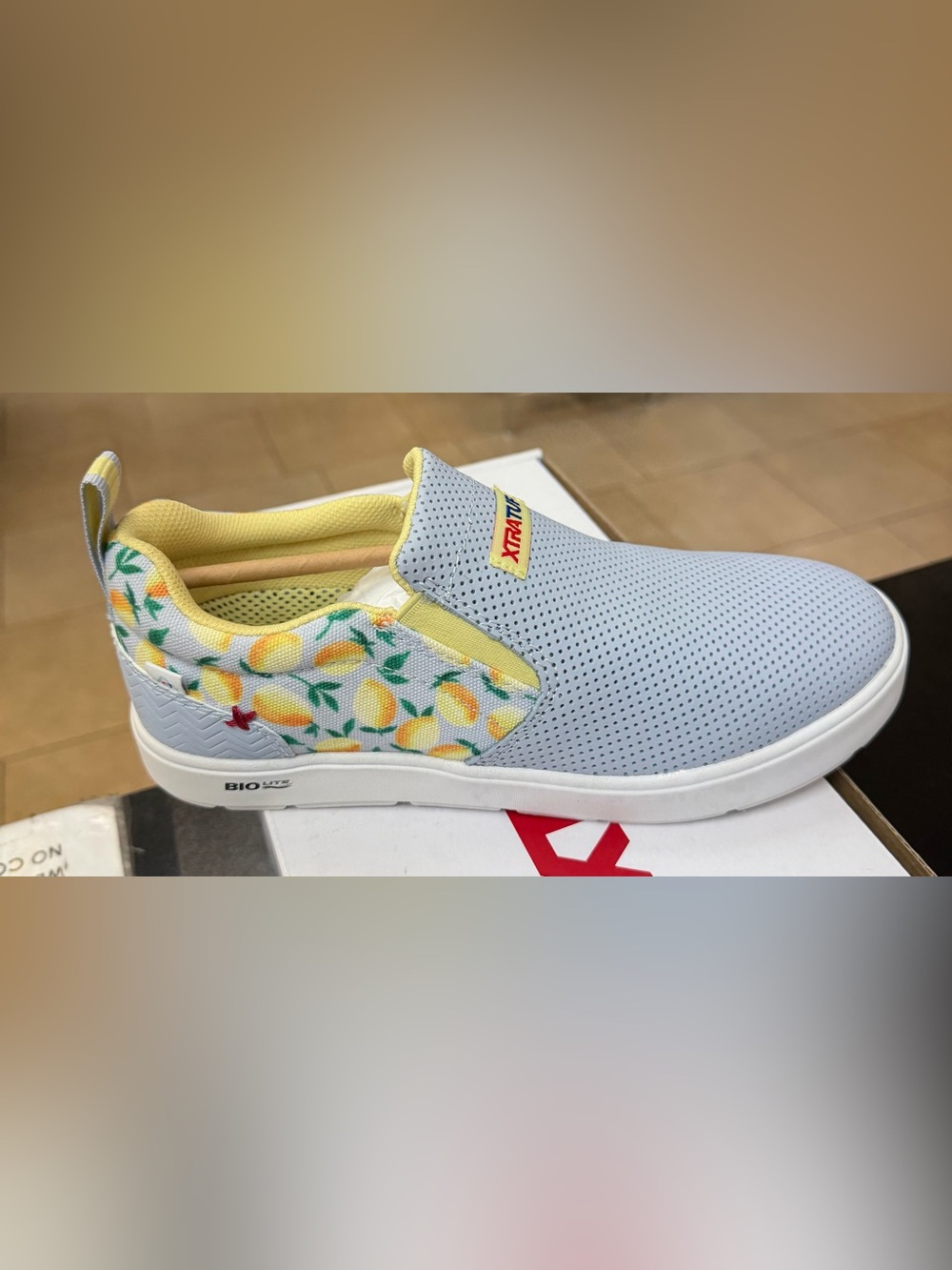 Xtratuf Women’s Lemon Print Slip-On Sneakers in Light Gray and Yellow